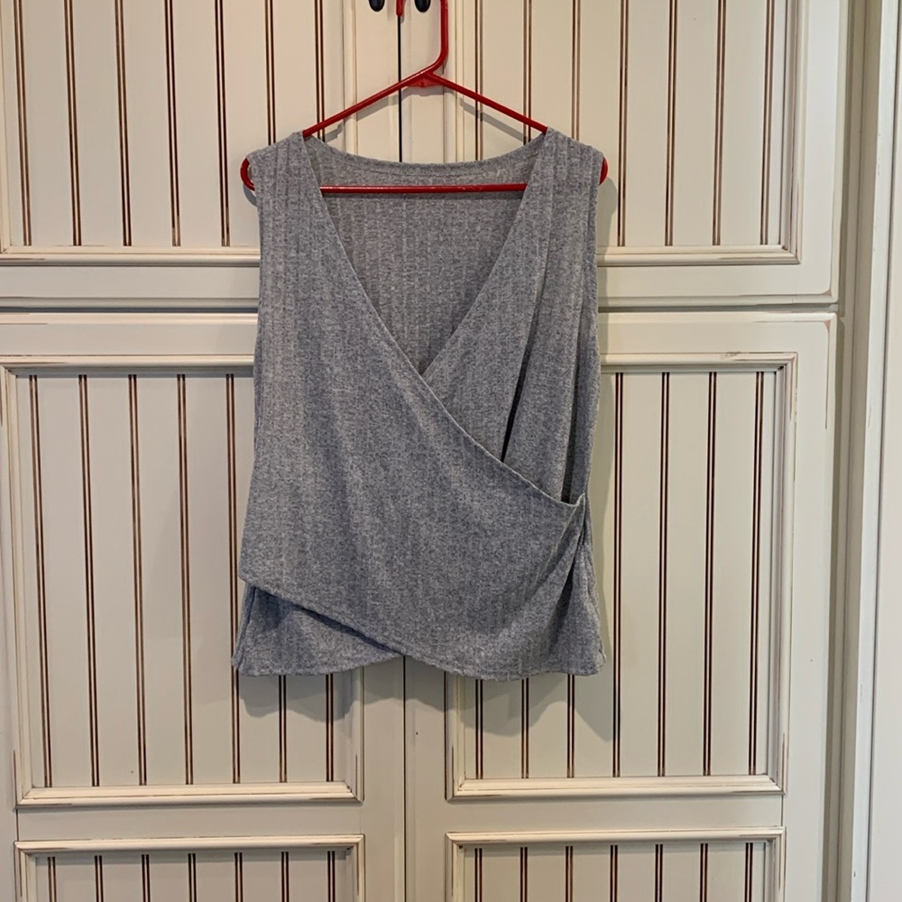 Cute little very lightweight crossbody sweater. Soft to the touch. Will match
